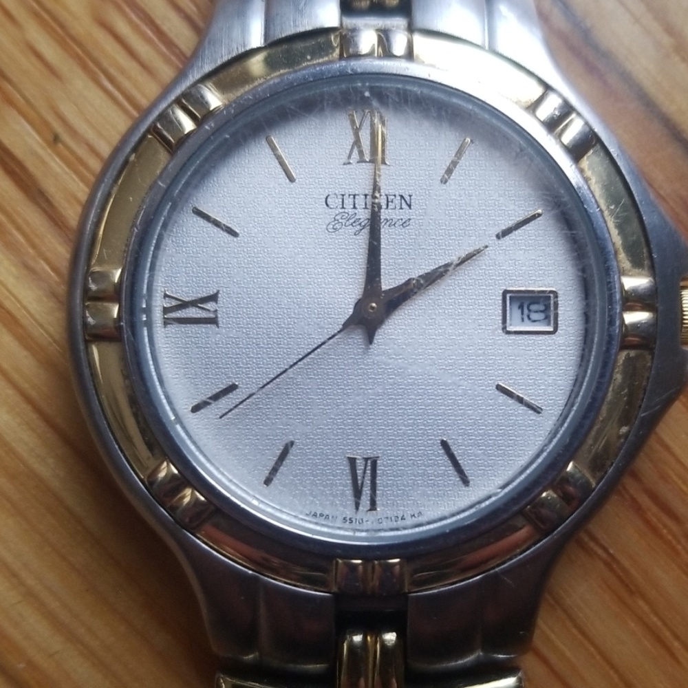 silver and gold citizen watch